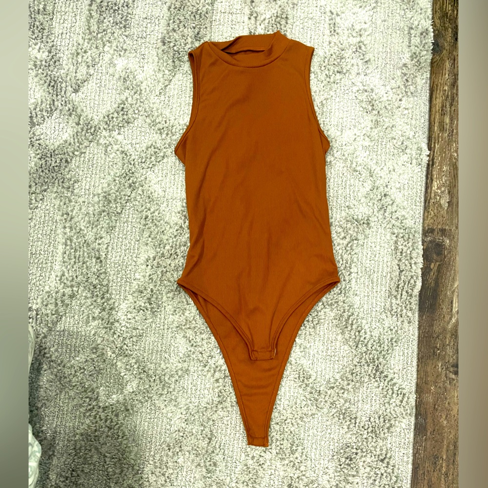 Burnt orange body suit